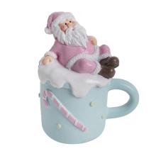 POLYRESINOVÝ SANTA CLAUS V HRNČEKU, RUŽOVÁ A TYRKYSOVÁ