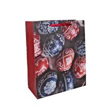 PAPIEROVÉ VRECÚŠKA S MATNÝMI, STUŽKOVÝMI CHLOPŇAMI, MODRÉ A ČERVENÉ VEĽKONOČNÉ VAJÍČKA