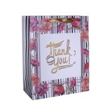 PAPIEROVÉ TAŠKY S MATNOU, STUŽKOVOU CHLOPŇOU, STRIEBORNOU POTLAČOU, KVETINOVÝM VZOROM, NÁPISOM "THANK YOU"