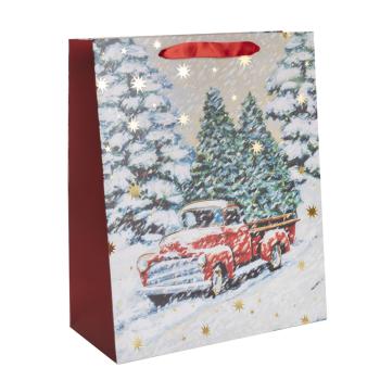 PAPIEROVÁ TAŠKA S MATNOU ZLATOU LESKLOU POTLAČOU, ČERVENÉ AUTO, BOROVICE