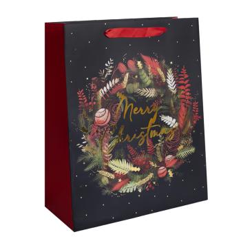 PAPIEROVÁ TAŠKA MATNÁ, ZLATÁ S LESKLOU POTLAČOU, "MERRY CHRISTMAS", ČIERNA A ČERVENÁ, VENIEC