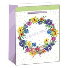 PAPIEROVÉ TAŠKY S MATNOU, HOLOGRAFICKOU STRIEBORNOU POTLAČOU, FAREBNÝM KVETINOVÝM VENCOM, S NÁPISOM " SZERETETTEL"