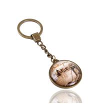 PRÍVESOK NA KĽÚČE Z KOVU A SKLA, V TVARE DISKU, SO VZOROM "BUDAPEST"